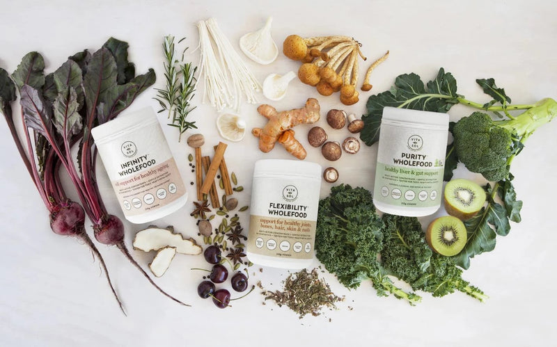 picture of vitasol wholefood powders amoungst fresh fruit and vegetables for good skin health